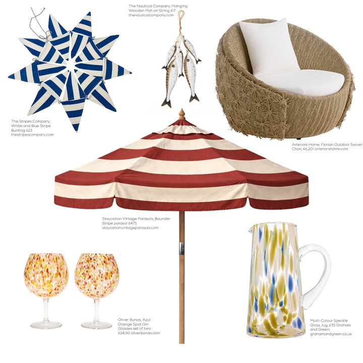 Summer outdoor accessories on a white background, including striped bunting, hanging wooden fish, a woven swivel chair, red-and-white parasol, colorful glasses, and a speckled glass pitcher.